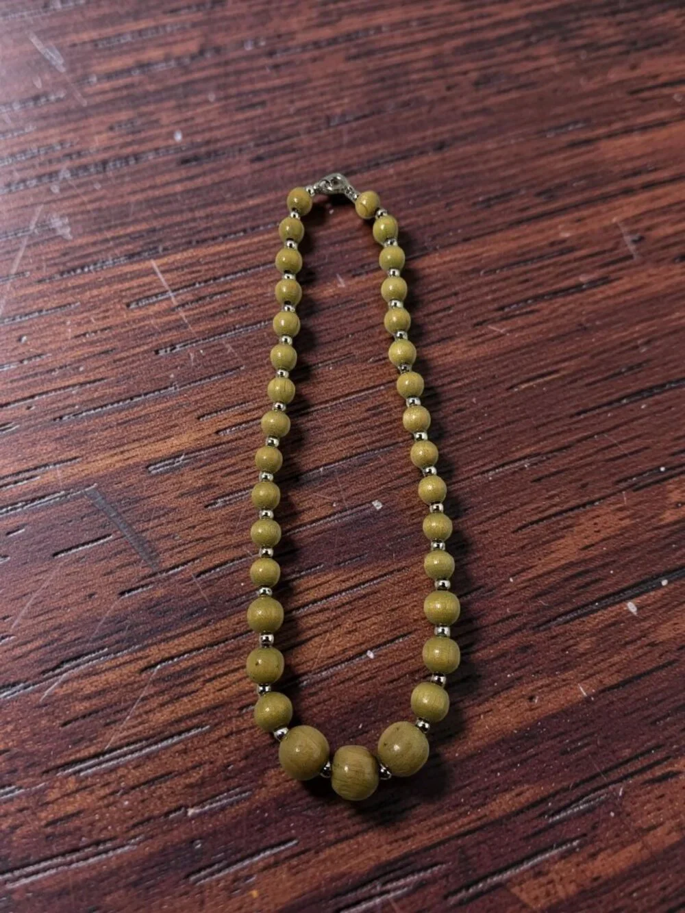 vintage polished olive wooden and silver metal beaded single row necklace